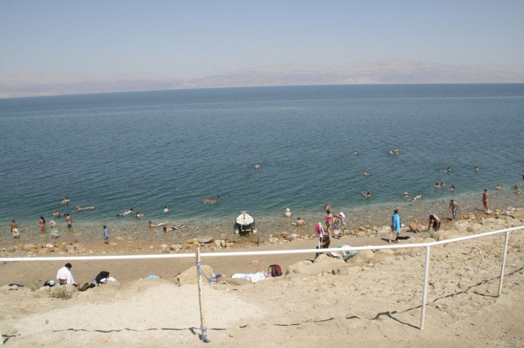 Swimmers floating in the Dead Sea at the Ein Gedi Public Beach.
